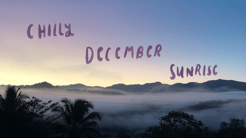 Cool blue and purple toned misty sunrise in the Puerto Rican mountains. Handwritten text reads "Chilly December Sunrise"