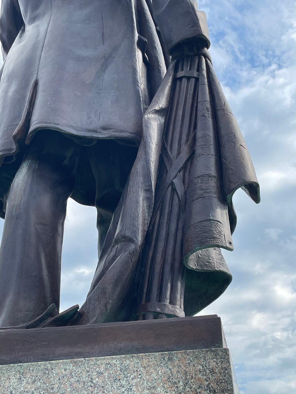 Around back, you see that McKinley's right hand actually rests on a flag-draped 'fasces,'