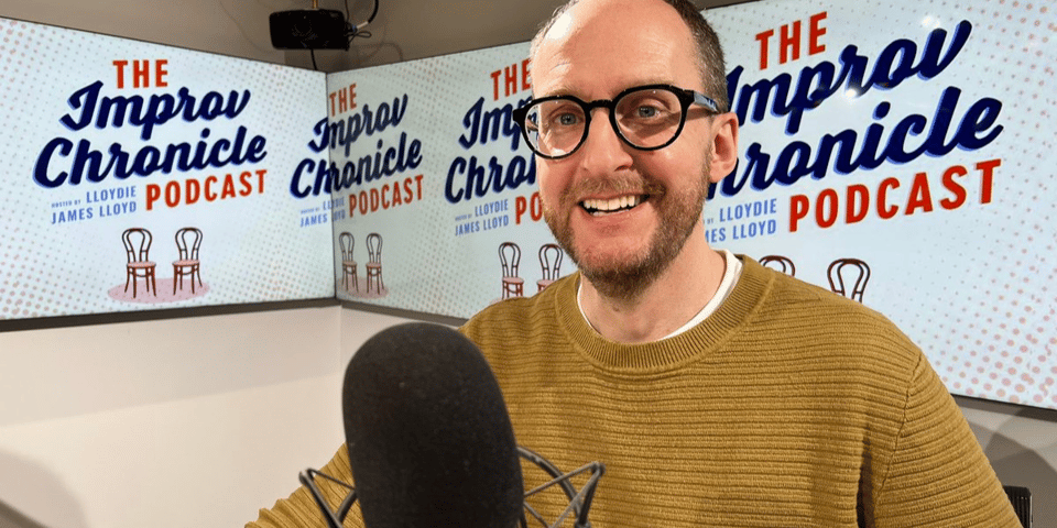 Lloydie in a very swish radio studio with giant LCD screens.