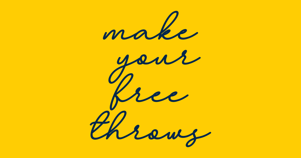 The works "make your free throws" in a font that's an approximation of the font on Kim Barnes Arico's Michigan sweater