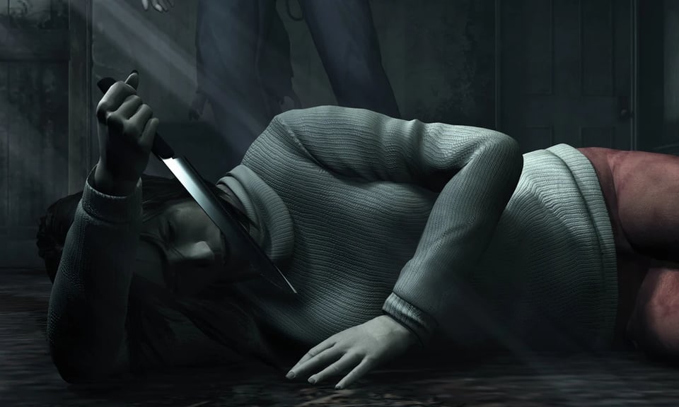 Angela lying on the floor holding her knife and looking at her reflection in a wall-sized mirror
