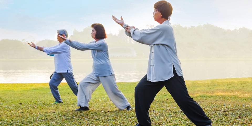 Three Tai Chi practitioners.