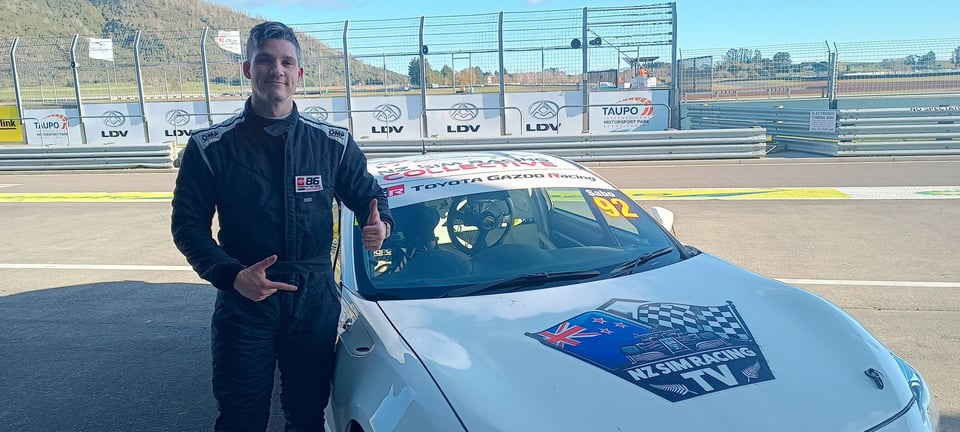 Antal Sabo in front of the Toyota 86 race car he drove