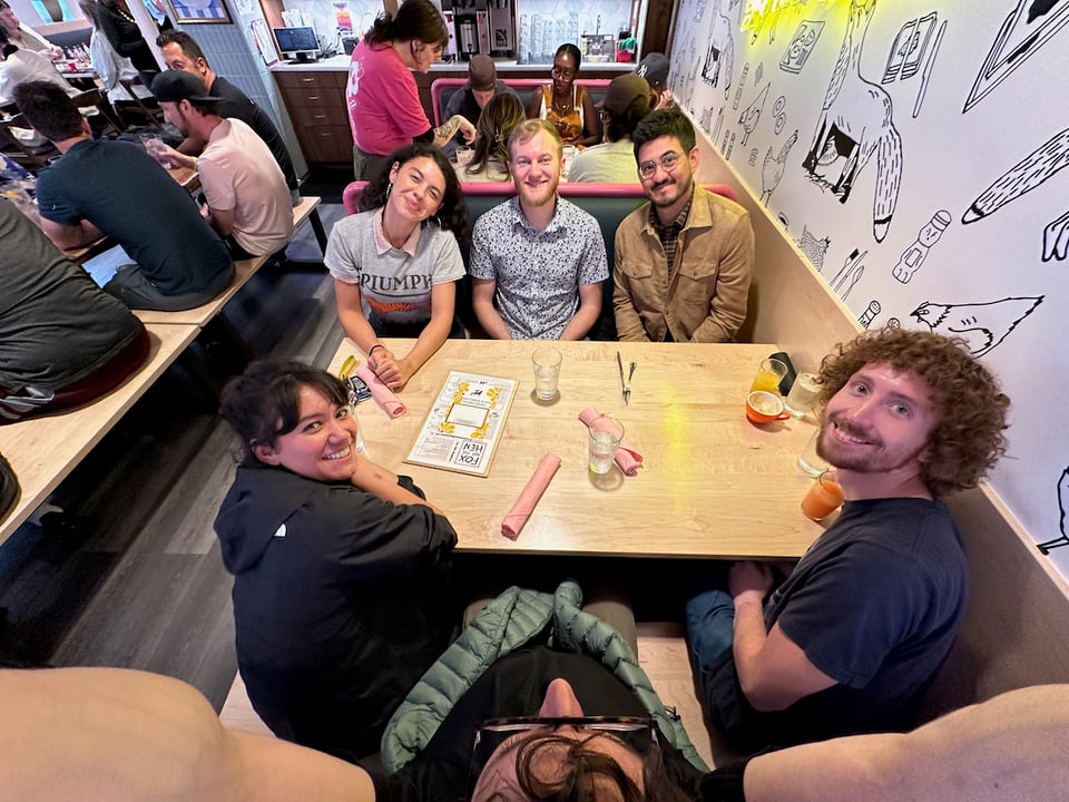 A group of friends in yet another room.
