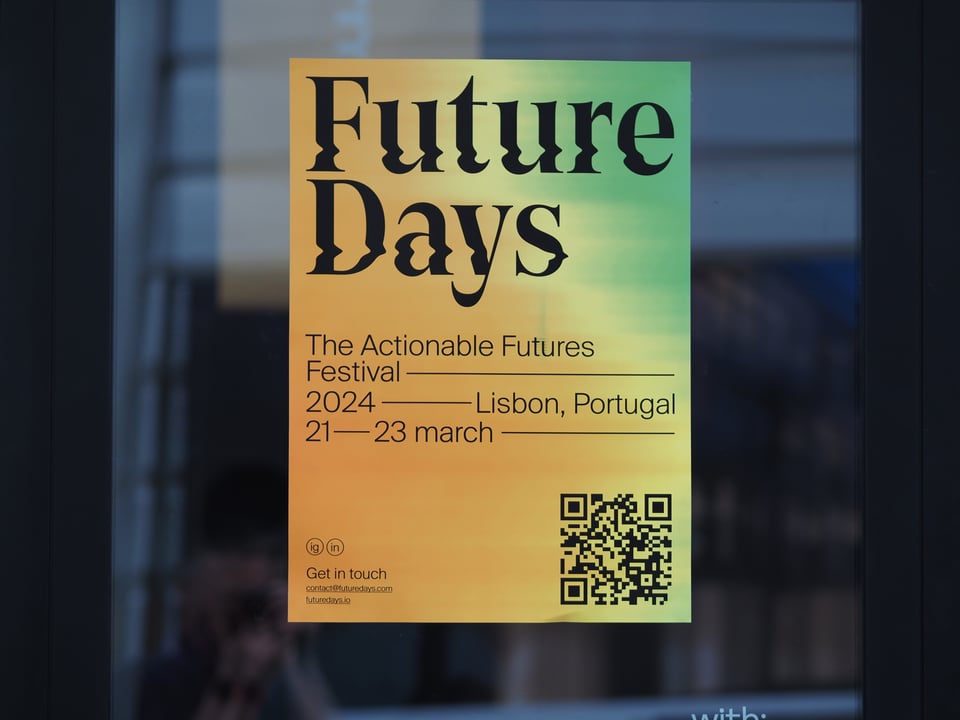 The Future Days poster on a glass window