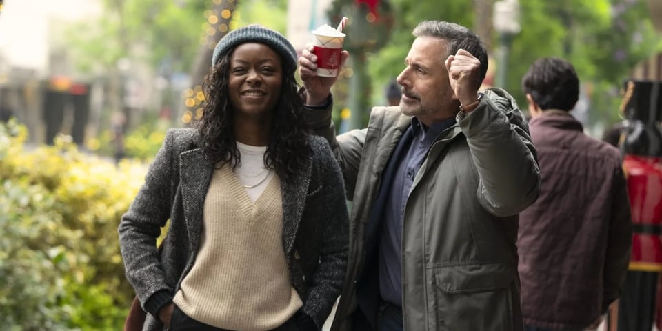 Steve Carell lifts up his hands with a lovely hot chocolate.