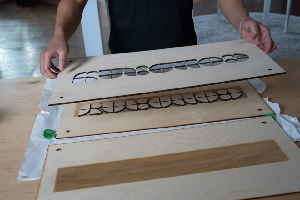 A laser cut wooden sign.