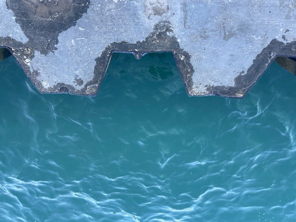 the edge between lake michigan and chicago is a jagged concrete wall
