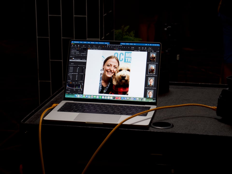 A picture of Kelsey and Ralph on a laptop screen at the QMT reception.