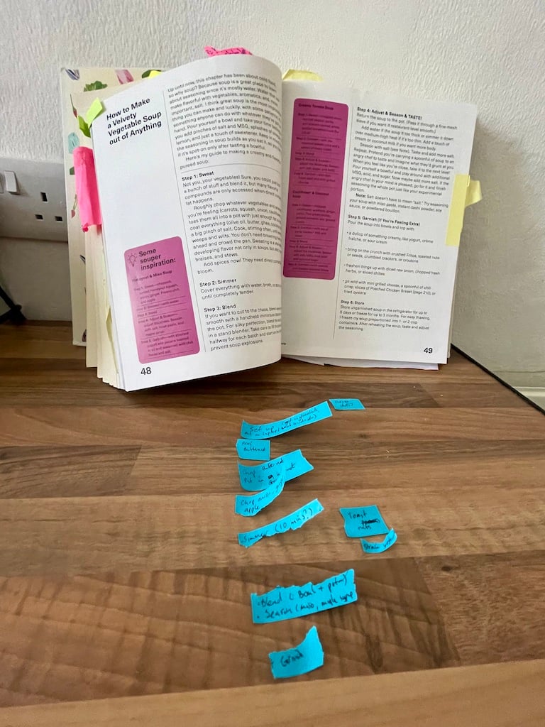 An open book and many blue post-its.