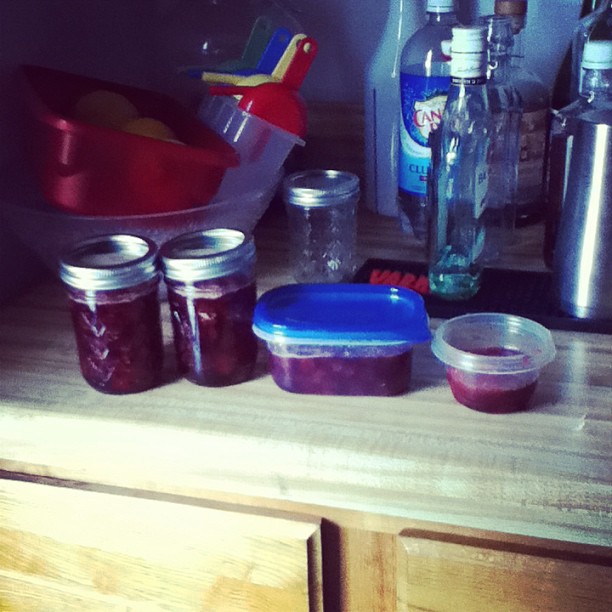 A filtered photo from Instagram of four containers on a cluttered counter