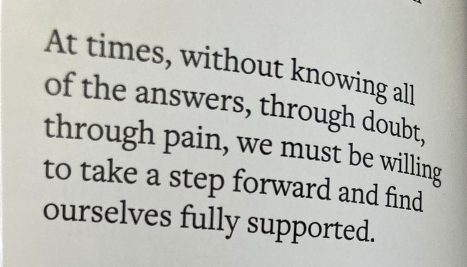 a quote from Grandma Baby's guidebook that reads "At times, without knowing all of the answer, through doubt, through pain, we must be willing to take a step forward and find ourselves fully supported."