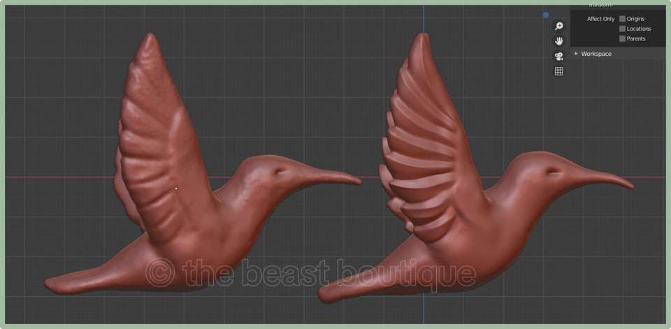 A screenshot of a blender workspace with two hummingbird figurines with their wings extended straight up from their backs loaded into it. One the left, the hummingbird is rougher, less refined. On the right, the bird's body has been smoothed, and the feathers in the wings have been defined and stylized in a somewhat angular way.

the shop name, the beast boutique, watermarks the image.