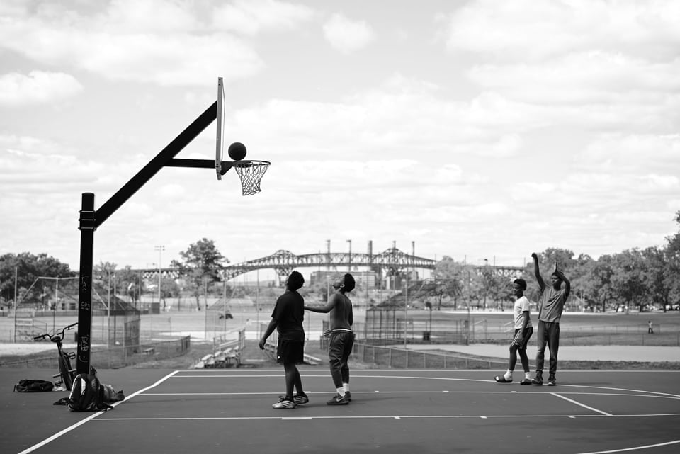 Boys playing basketball in Jersey City