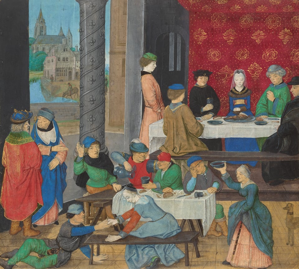 A scene of people eating and drinking, with fancy people sitting in back soberly consuming food. In the front, folks are drunk and literally on the floor.