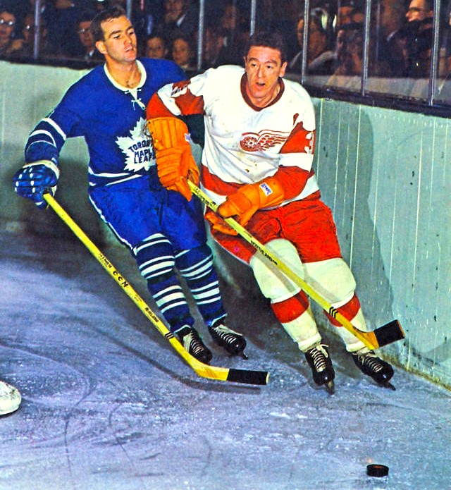 Detroit’s Marcel Pronovost shakes off the Leafs’ Dick Duff in a classic early 1960s matchup.