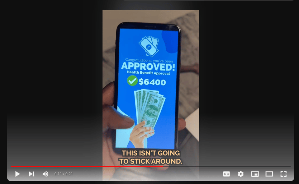 Screenshot from YouTube showing approval image for the scam on a cell phone
