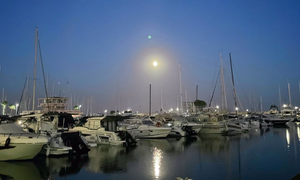 Boats docked in a harbour in Nettuno, Italy.