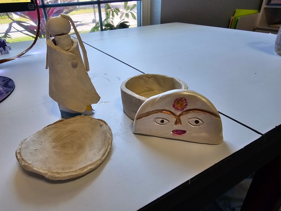 clay figurines on a table