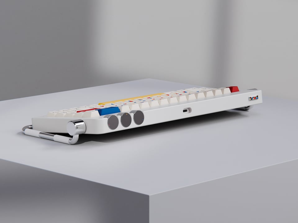 a white keyboard sitting on top of a table