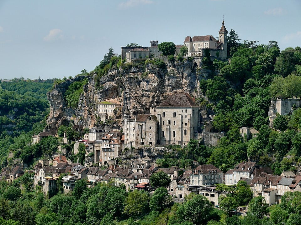 A lovely French village built into a cliffside. Green trees. Stone buildings. Excellent cheese not pictures.