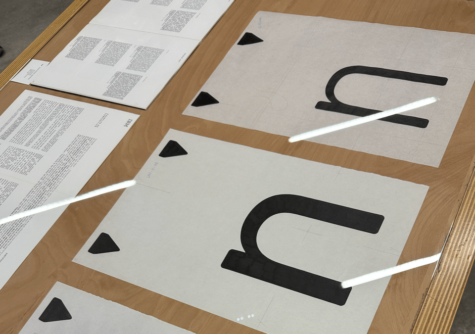 Two full size drawings of the University n, a version drawn for typewriters.