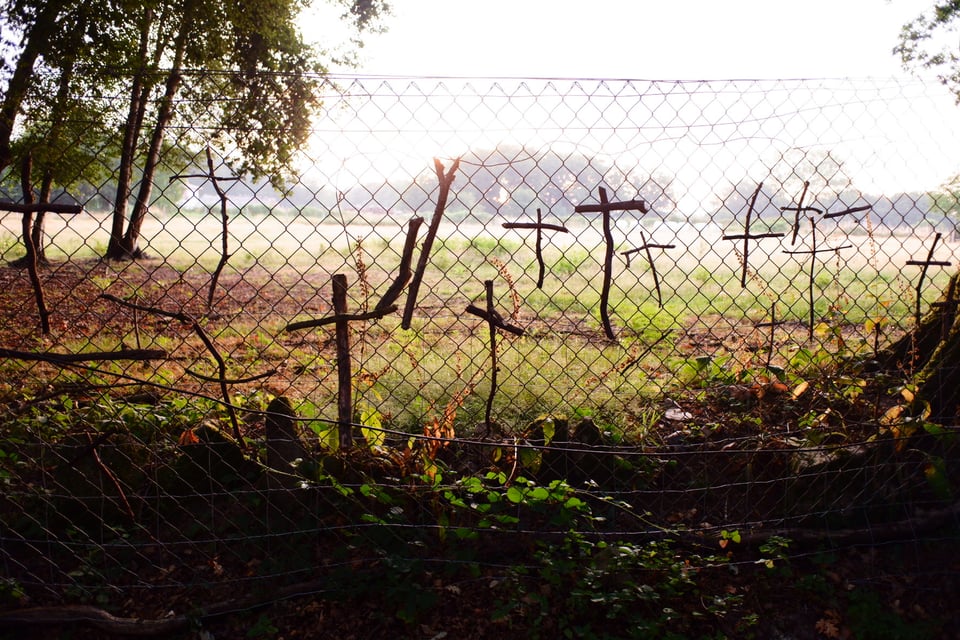 Fence with hand-made crosses