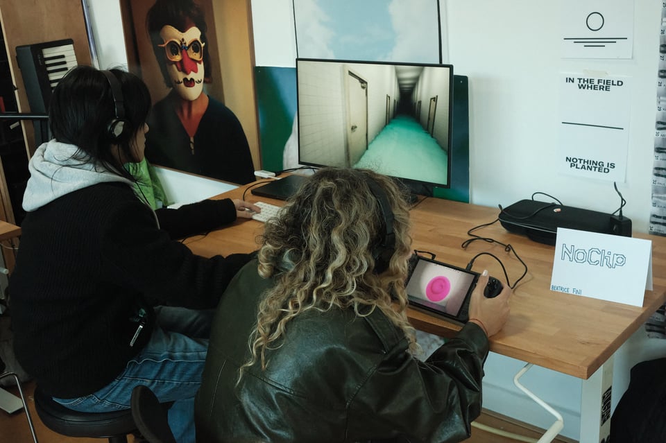two persons playing a videogame