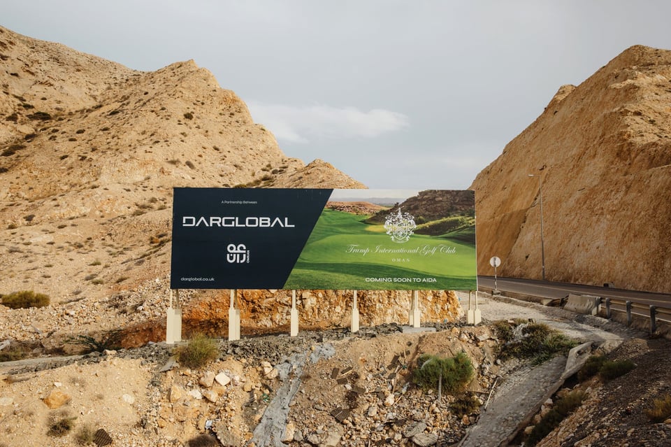 A billboard promoting a partnership between DarGlobal and the Trumps to develop a golf club in Oman