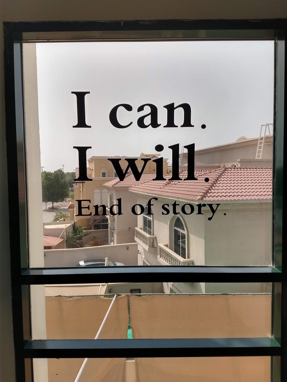 Sticker over window "I can. I will. End of Story."