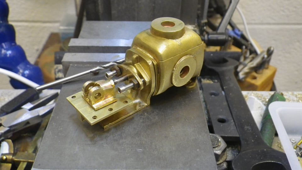 The brass pump on a work bench