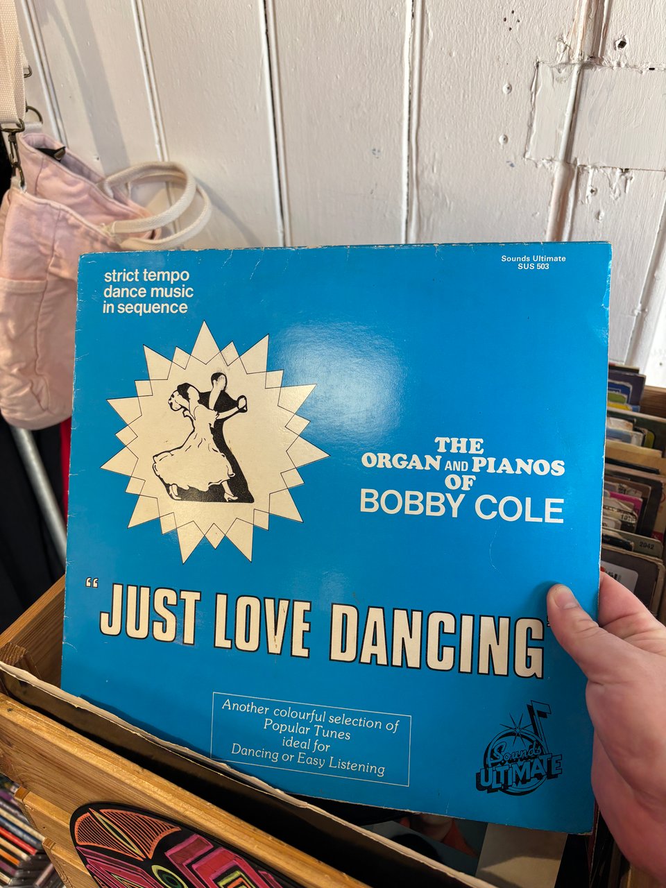 I am holding a mystery record in a charity shop: "The Organ and Pianos of Bobby Cole: "JUST LOVE DANCING".