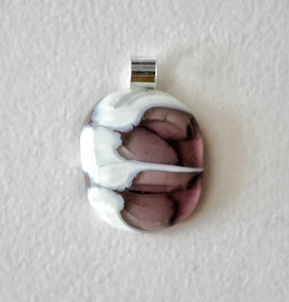 purple and cream colored pendant. it's pretty weird looking, the cream really moved in an interesting way when it was a liquid