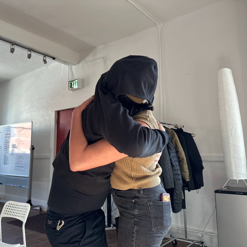Dan and Michelle hugging.
