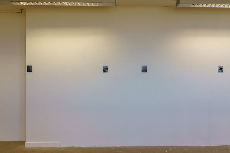 Wall with the photos missing