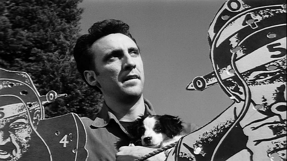 Timothy Carey with a puppy