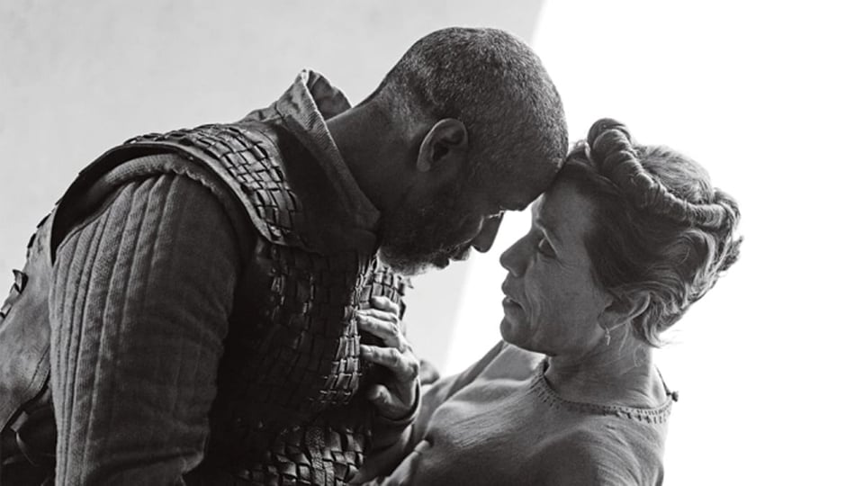 A black and white image from the movie The Tragedy of Macbeth, featuring Denzel Washington and Frances McDormand. 