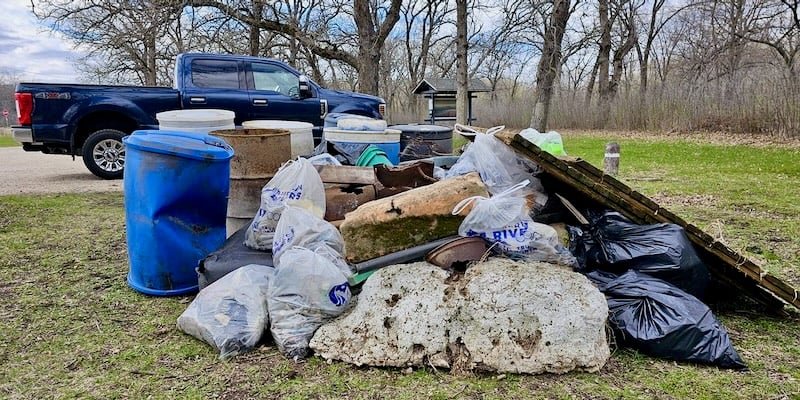 Look at all that trash! And we were even able to get out the big stuff that floated in thanks to Old Frontenac resident and good neighbor Rick Landau, who showed up gleefully chomping on a cigar on his four-wheeler. Rick roared back and forth to haul out the stuff we couldn’t drag out by hand. (Don’t worry, the very nice pickup in the background wasn’t part of our debris! But, read on…) / Photo by Rick Landau