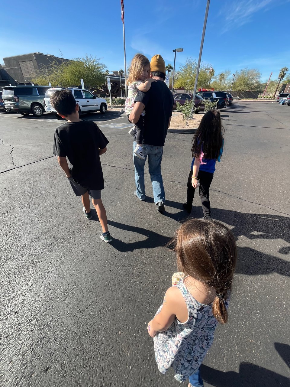 Michael and our kids walking towards the phoenix art museum
