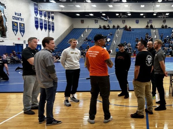 Jonathan Gomez, Community Liaison for CeaseFirePA’s Firearm Suicide Prevention Team in the Poconos, meeting with coaches prior to the start of the match