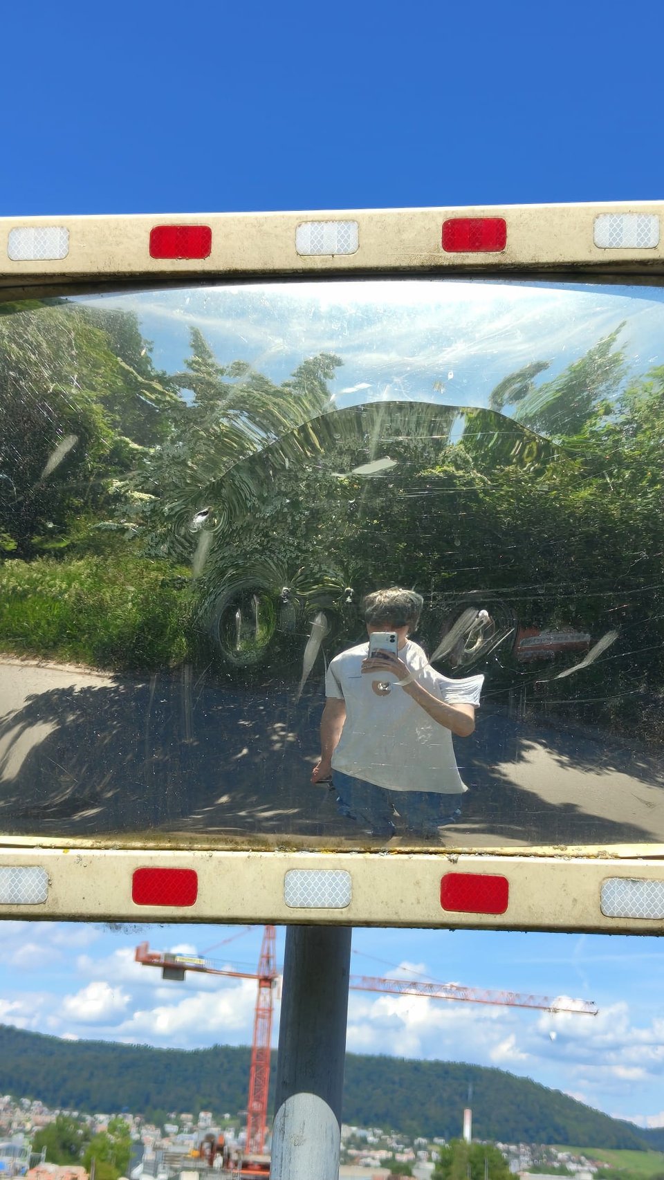 a photo of me in a mirror outside