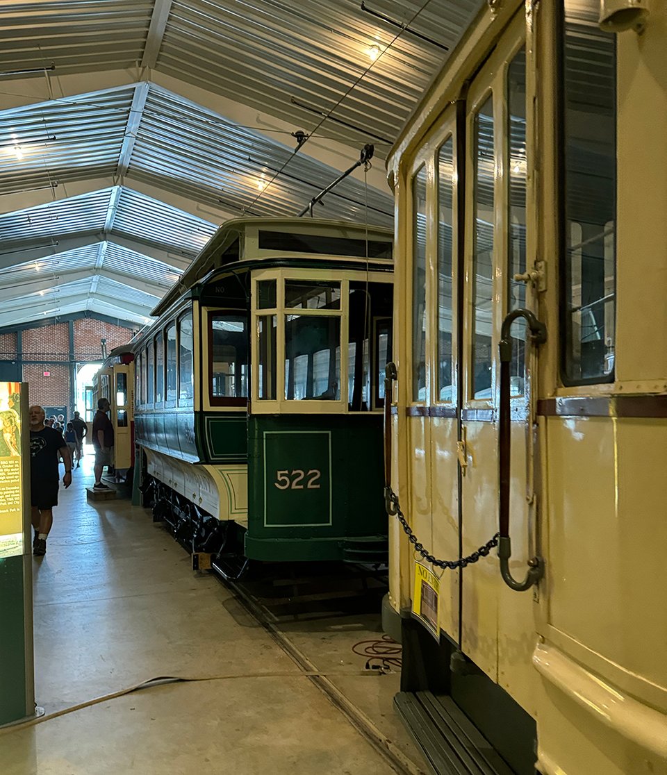 Two streetcars in a car barn