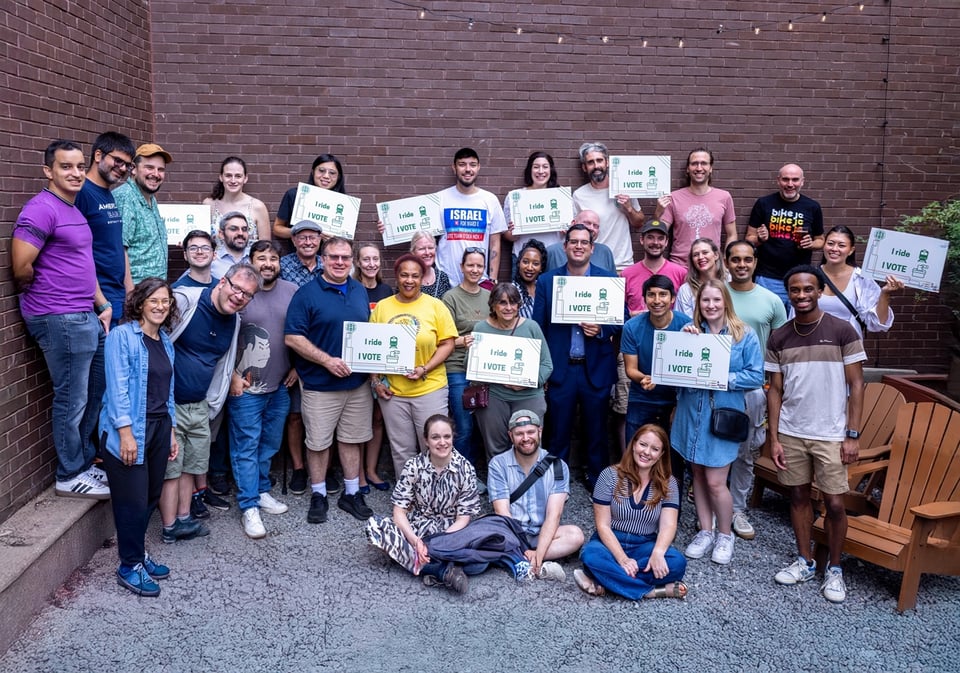 a group of people holding signs