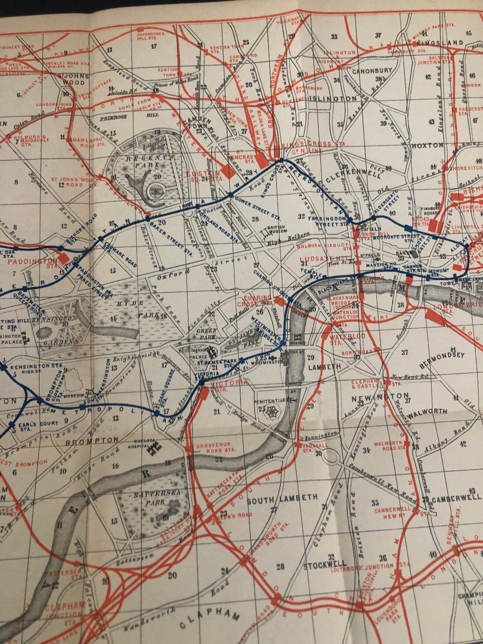 a fold-out map of centrla London, showing the Metropolitan train line (subway) in blue, and the various above-ground train lines in red.