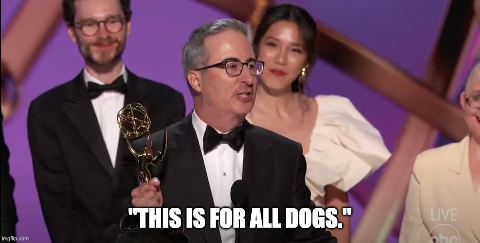 A screenshot of John Oliver accepting an Emmy Award, saying "This is for all dogs."
