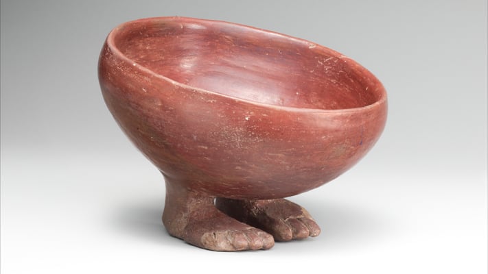 A photograph of a 4000 year old red clay footed bowl
