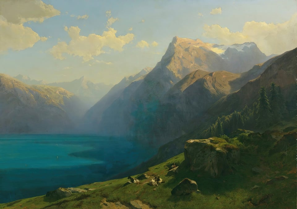 View of a blue lake in Lucerne with mountains in the background
