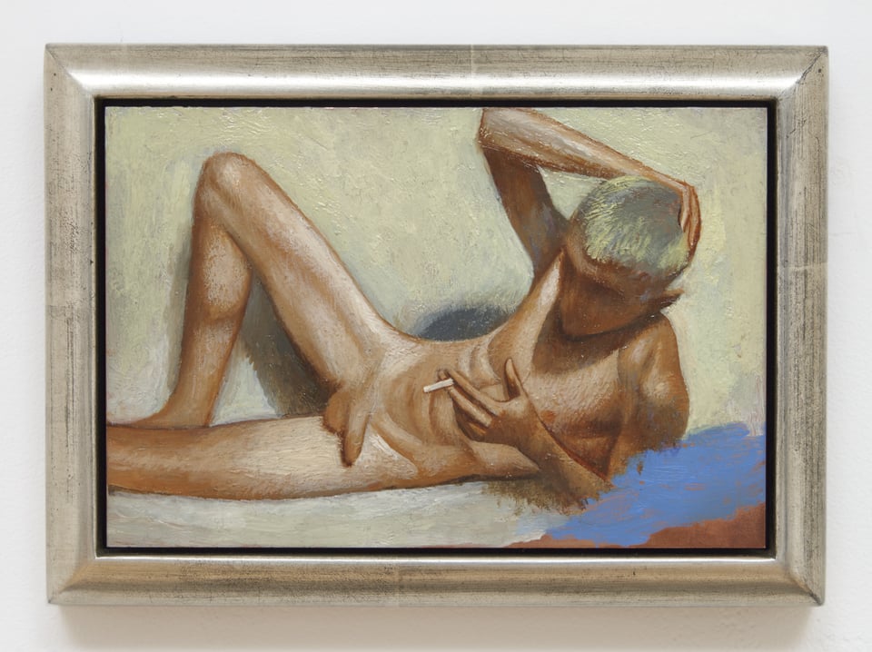 A small oil painting on copper with a metallic frame. It shows a young man, no body hair, reclining with one leg up and smoking a cigarette. The background is yellow. The figure is Nikos, a frequent subject of Juline Nguyen's work.