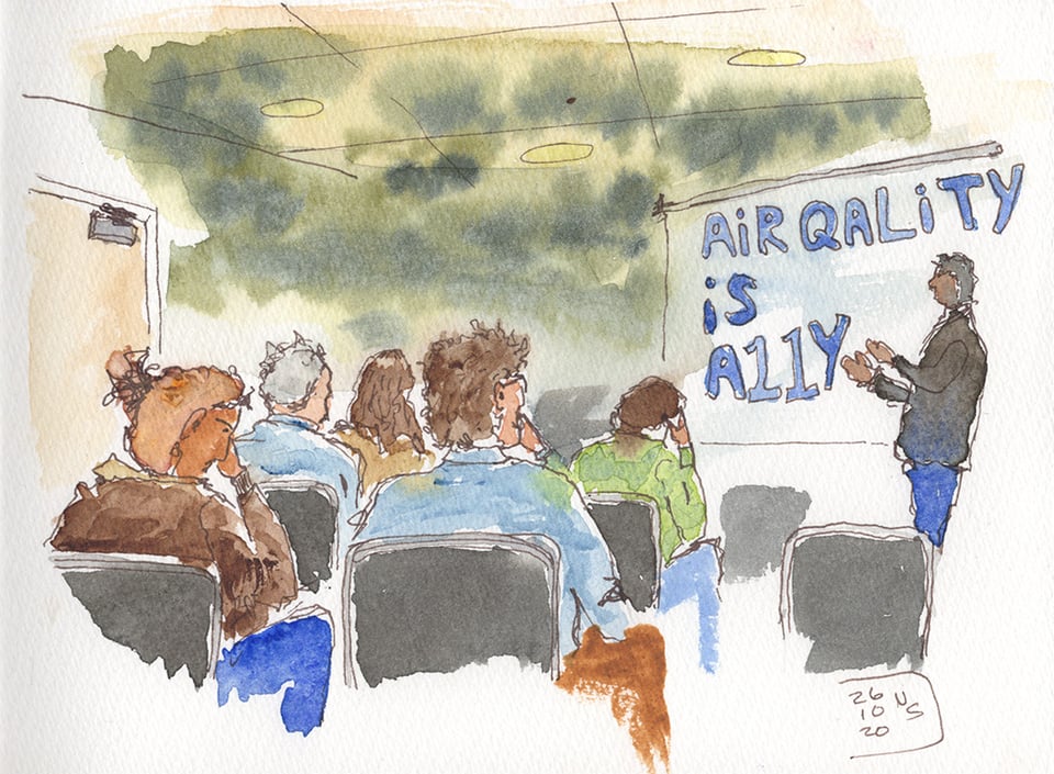 Ink and watercolor sketch of an audience watching a presenter beside the words “Air quality is A11Y” on a white board. A murky, sickly green wash hangs over the room, making the air itself look nauseating. Signed and dated October 20, 2026. NS.