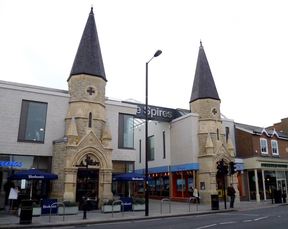 A shopping centre built around two spires of an otherwise demolished church.